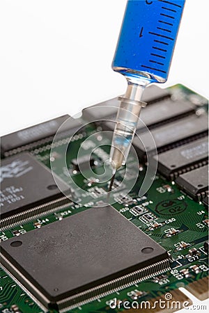 Glass syringe and circuit board Stock Photo