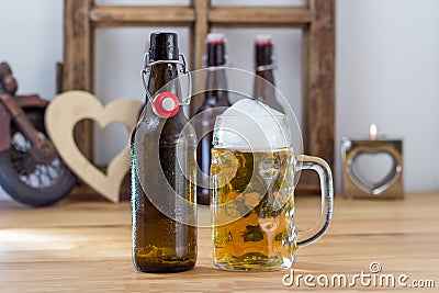 Glass tankard of chilled beer with a bottle Stock Photo