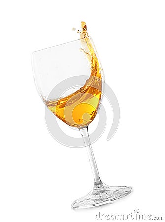 Glass of tasty wine with splashes on white background Stock Photo