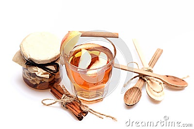 Glass of tea with apple slices and rustic entourage Stock Photo