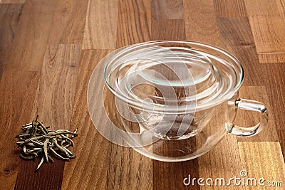 Glass tea cup tea strainer and loose tea Stock Photo