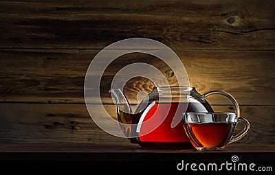 Glass teapot with black tea Stock Photo