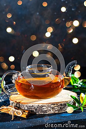 Glass teapot with hot tea. Place for text . Stock Photo