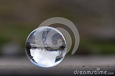Glass transparent crystal ball on dark green Stock Photo