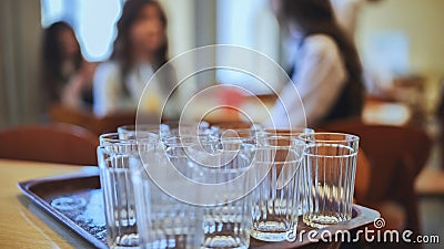 Glass tumblers in the school cafeteria. Stock Photo