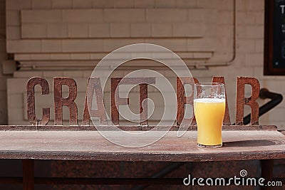 A glass of unfiltered beer on the bar Stock Photo