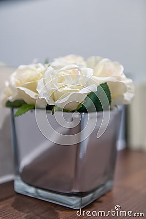 Glass Vase of Cream Silk Roses Stock Photo
