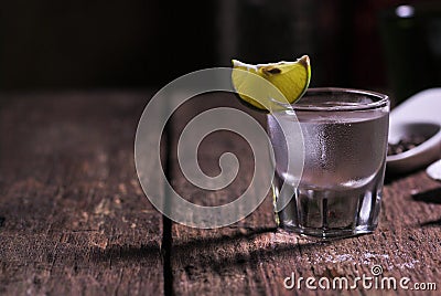 Glass of vodka shot with fresh lime Stock Photo