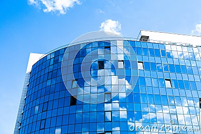 Glass wall facade with cloud sky reflection. Modern urban architecture background. Skyscraper business center, bank or hotel in Stock Photo