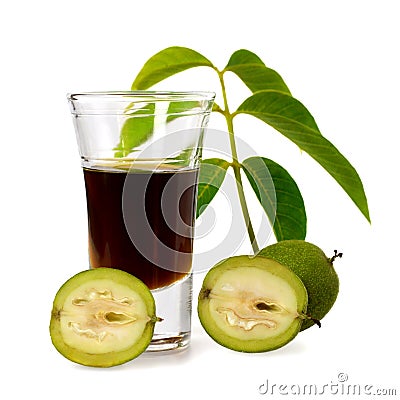 Glass of walnut liqueur isolated on white Stock Photo