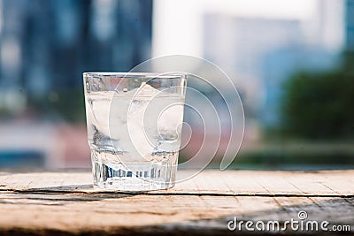 Glass of water and ice on the table - cold filter Stock Photo