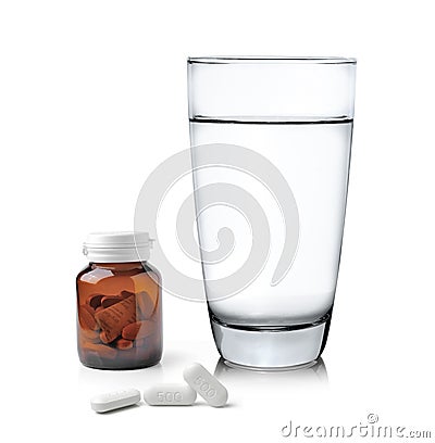 Glass of water Medicine bottle and pills Stock Photo