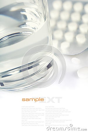 Glass of Water and Pills Stock Photo