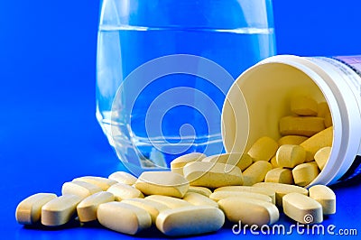 Glass of water and pills Stock Photo