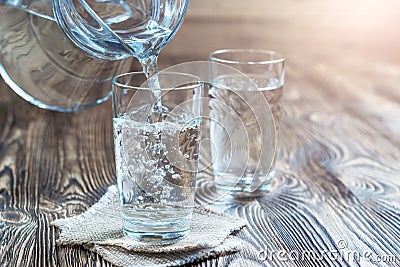 Glass of water on a wooden table Stock Photo