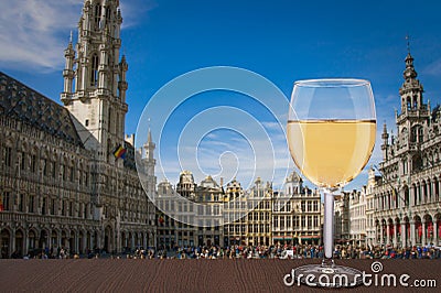 Glass of white wine with view of Grand Place Grote Markt in Brussels, Belgium Stock Photo