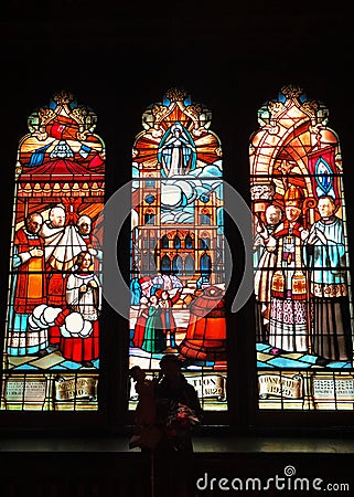 Glass windows with patterns inside Notre-Dame Basilica church Editorial Stock Photo