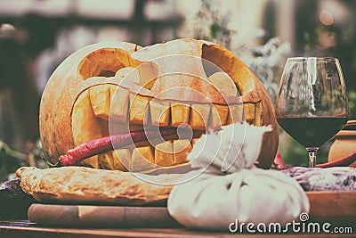 A glass of wine with decorations for Halloween on the table Stock Photo