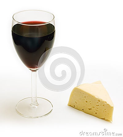 Glass of wine and piece of cheese Stock Photo