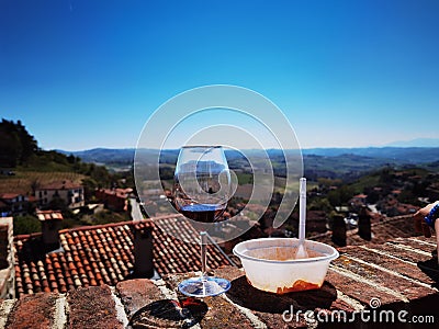 Glass of wine and plate of ravioli Stock Photo