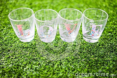 Glass wrote love side lay on the grass. Stock Photo
