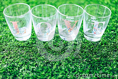 Glass wrote love side lay on the grass. Stock Photo