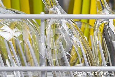Glass yellow and green plates, background of clean kitchen utensils Stock Photo