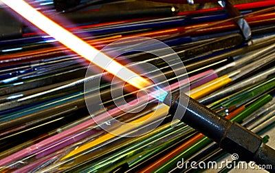 Glassblowers Torch and Colored Glass Stock Photo