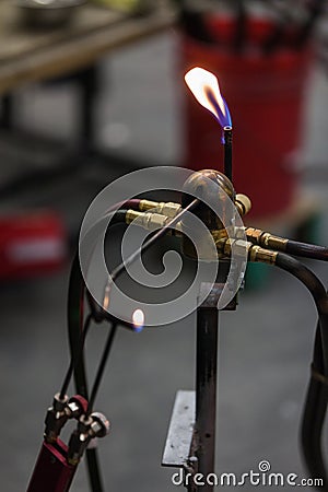 Glassblowing Work Place and Propane Torch Pilot Flame Stock Photo