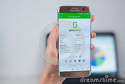 GlassDoor web site opened on the mobile Editorial Stock Photo
