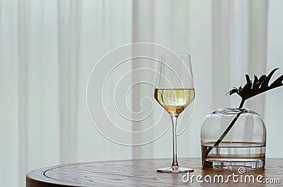 A glasse of white wine on wooden table Stock Photo