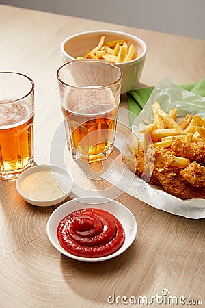 Of beer, chicken nuggets with french Stock Photo