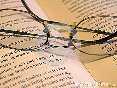 Glasses on book Stock Photo