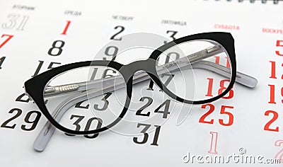 Glasses are on the calendar Stock Photo