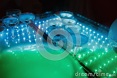 Glasses of champagne beautifully illuminated at the party. Banquet service Stock Photo