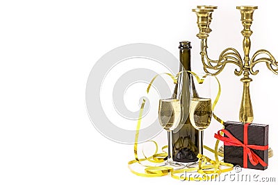 Glasses of champagne, gift box and party streamers. Stock Photo