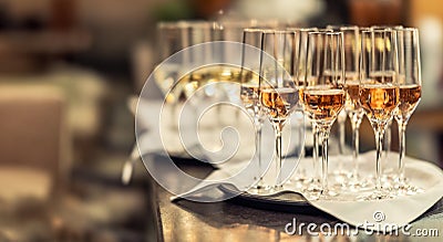 Glasses of champagne or prosecco prepared for guests at the bar counter in the hotel as a welcome drink Stock Photo
