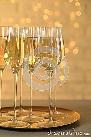 Glasses of champagne served on grey table Stock Photo