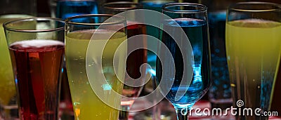 Glasses with a cocktail. Multicolored drinks. Stock Photo