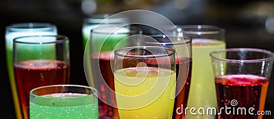 Glasses with a cocktail. Multicolored drinks. Stock Photo