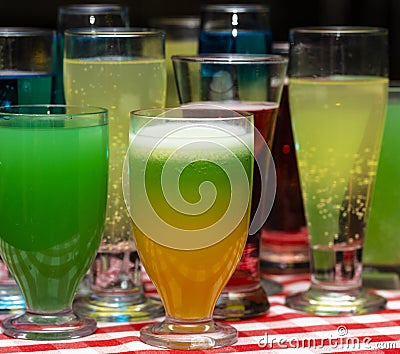 Glasses with a cocktail. Multicolored drinks. Stock Photo