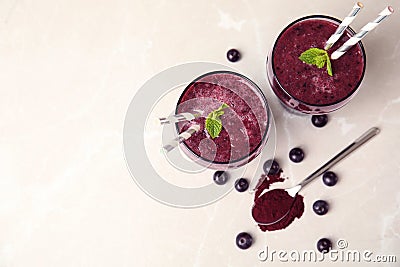 Glasses with delicious acai smoothie on table Stock Photo