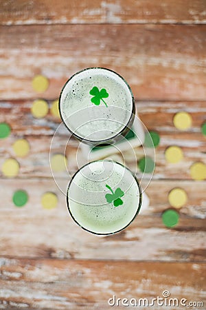 Glasses of green beer with shamrock from top Stock Photo