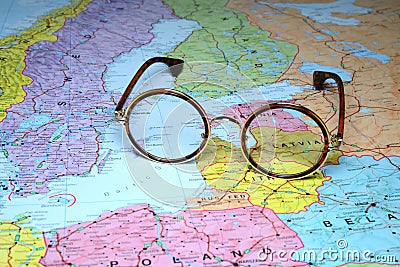 Glasses on a map of europe - Latvia Cartoon Illustration