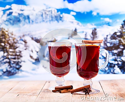 Glasses of mulled wine over winter landscape Stock Photo