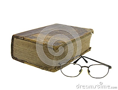 Glasses near very old bible Stock Photo