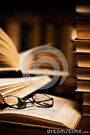 Glasses on open books Stock Photo