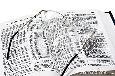 Glasses over open bible Stock Photo