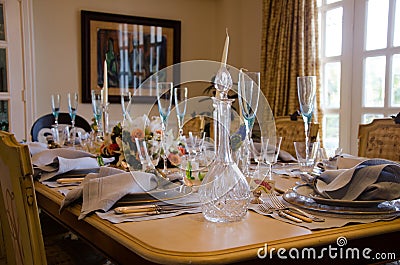 Glasses, plates, forks, knives and napkins on the table Stock Photo