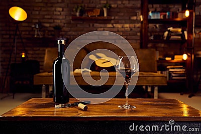 Glasses of red wine on table at home Stock Photo
